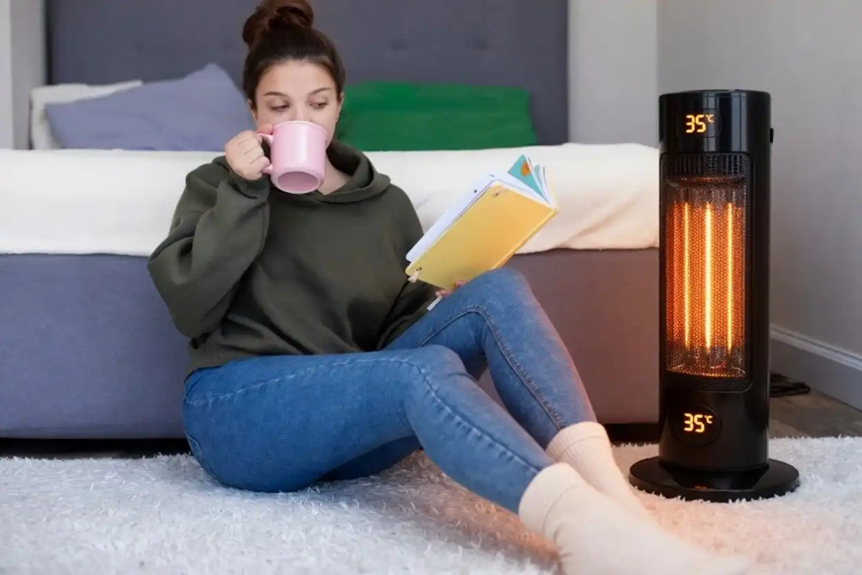 Woman comfortably reading with HeatWave Ceramic beside her